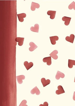 A close-up of a notebook or journal cover featuring a cream background patterned with scattered pink and red hearts, with a solid reddish-brown vertical spine or edge on the left.