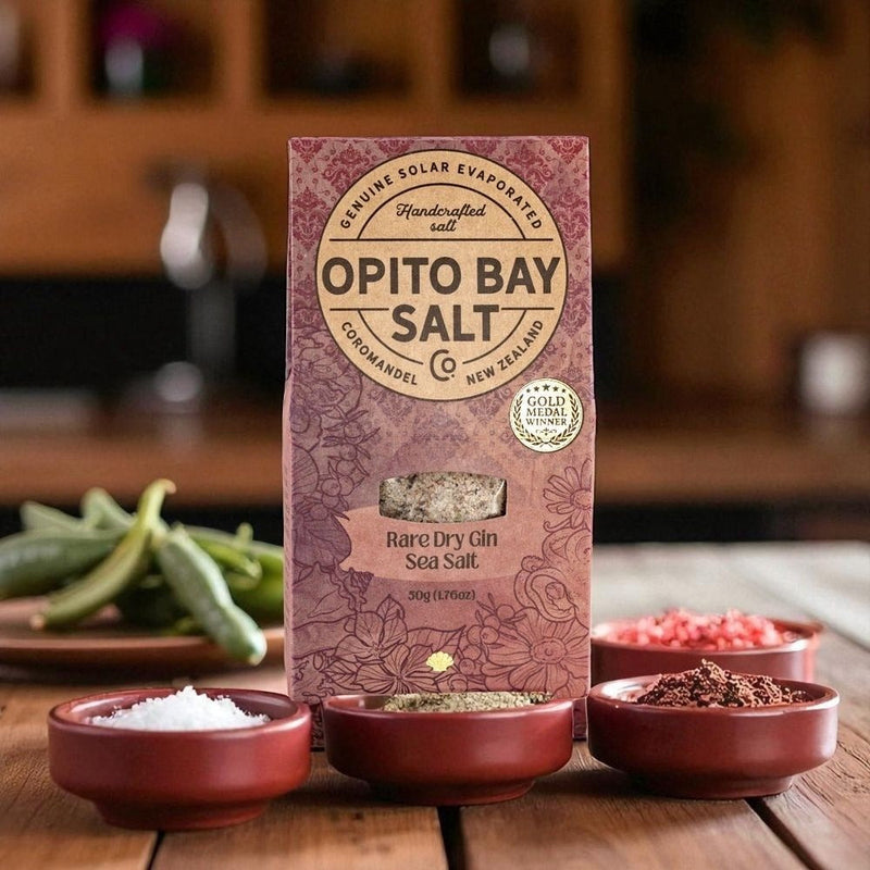 Opito Bay Salt Rare Dry Gin Sea Salt 50g bag, gold medal winner, handcrafted in Coromandel New Zealand, styled with salt bowls on a rustic wooden kitchen bench