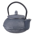 Teaology cast iron teapot in dark blue with a linear ribbed pattern and a black handle
