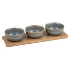 Ladelle Cameo four piece set with three grey-blue bowls on a bamboo tray