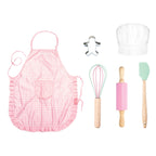 Avanti Yum Yum kids baking set with a pink apron, chef's hat, rolling pin, whisk, spatula and cookie cutter