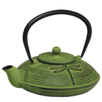 Teaology cast iron teapot in green with a dragonfly design and a black handle