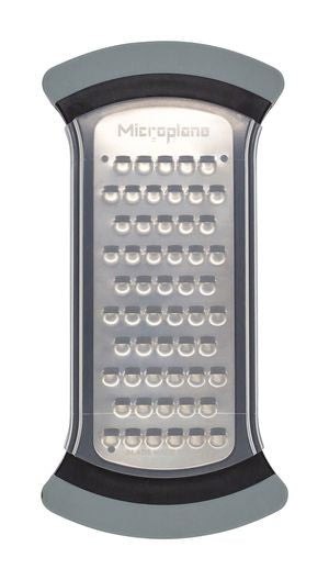 Microplane bowl grater with a stainless steel plate and a grey and black rim