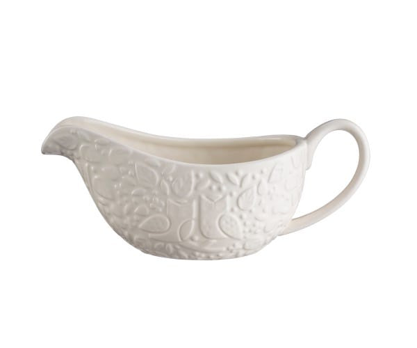 Mason Cash In The Forest gravy boat in cream with embossed woodland detail and a curved handle