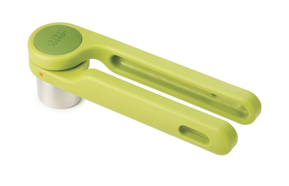 Joseph Joseph Helix garlic press in lime green with a folding twist handle and a steel chamber