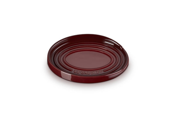 Le Creuset stoneware oval spoon rest in deep red with ridged rings