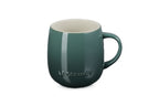 Le Creuset stoneware U mug in deep green with a rounded body and a curved handle