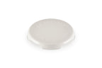 Le Creuset cast iron Signature round trivet in cream with the Le Creuset name on the top