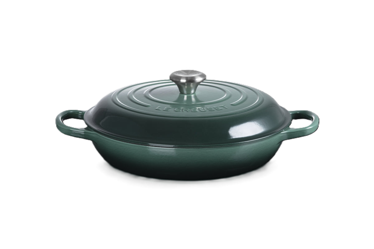 Le Creuset Signature shallow casserole in dark green enamelled cast iron with a lid and two side handles
