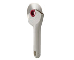 Joseph Joseph Ringo pizza wheel with a cream handle and a raspberry coloured centre hub