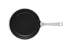Le Creuset non-stick ceramic frying pan in black with a stainless steel handle
