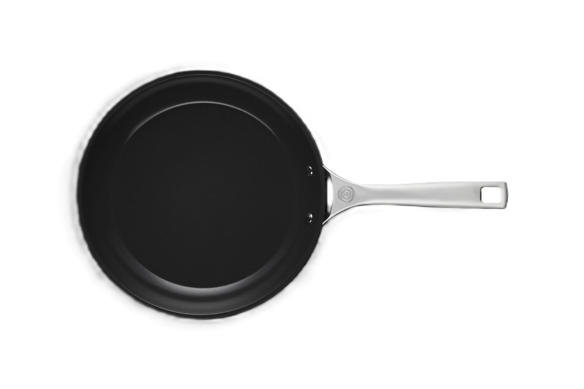 Le Creuset non-stick ceramic frying pan in black with a stainless steel handle