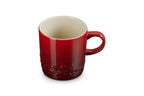 Le Creuset Holly mug in Cerise red stoneware with an embossed holly design