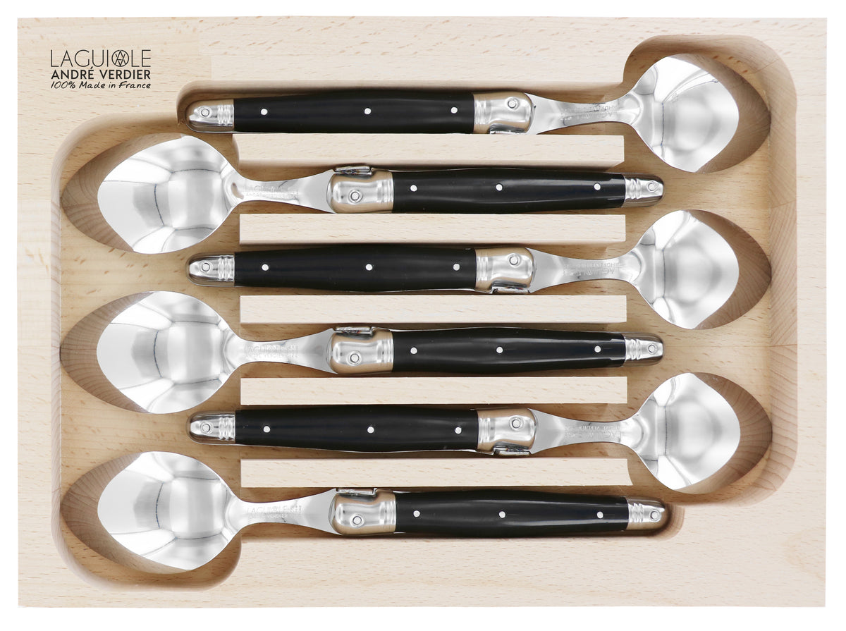 Andre Verdier Laguiole dinner spoon set, six with black handles, shown in a wooden tray