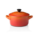 Le Creuset mini stoneware casserole, 9cm and 250ml, in flame orange with a lid and two handles