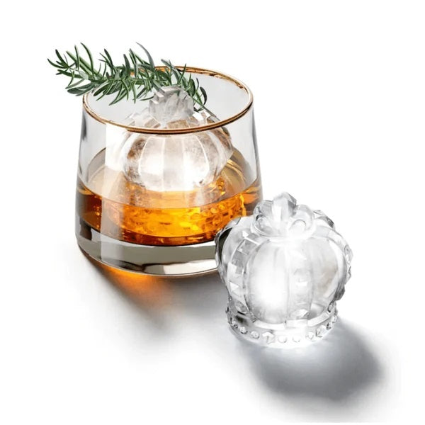 Zoku Crown ice mould set, a crown-shaped mould beside a clear ice crown in a glass of whisky with rosemary