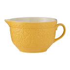 Mason Cash Home To Roost batter bowl in yellow with an embossed hen design and a pouring lip and handle