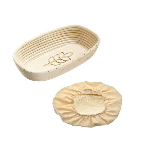 Westmark oval fermentation basket in natural cane with a leaf motif, shown with its linen liner