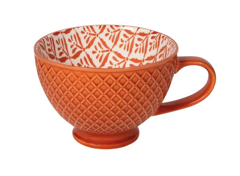 Now Designs Copper Leaves latte stoneware mug in burnt orange with a textured exterior and a cream leaf-patterned interior