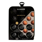 Bakemaster mini muffin pan in dark non-stick steel, shown in its packaging with mini muffins