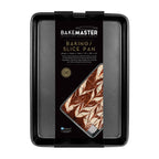 Bakemaster baking and slice tray in dark non-stick steel, shown in its branded packaging
