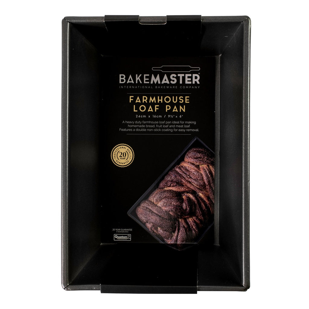 Bakemaster farmhouse loaf pan in dark non-stick steel, shown in its packaging with a photo of a loaf