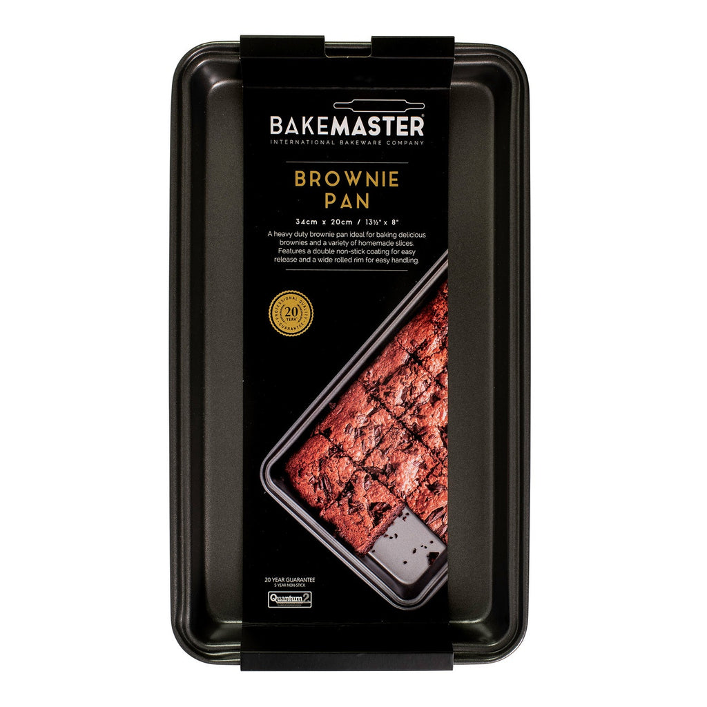 Bakemaster brownie pan in dark non-stick steel, shown in its packaging with a photo of brownies