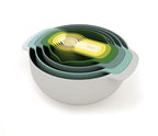Joseph Joseph Nest 9 Plus in Opal, nested bowls, a sieve and measuring cups in shades of green and grey