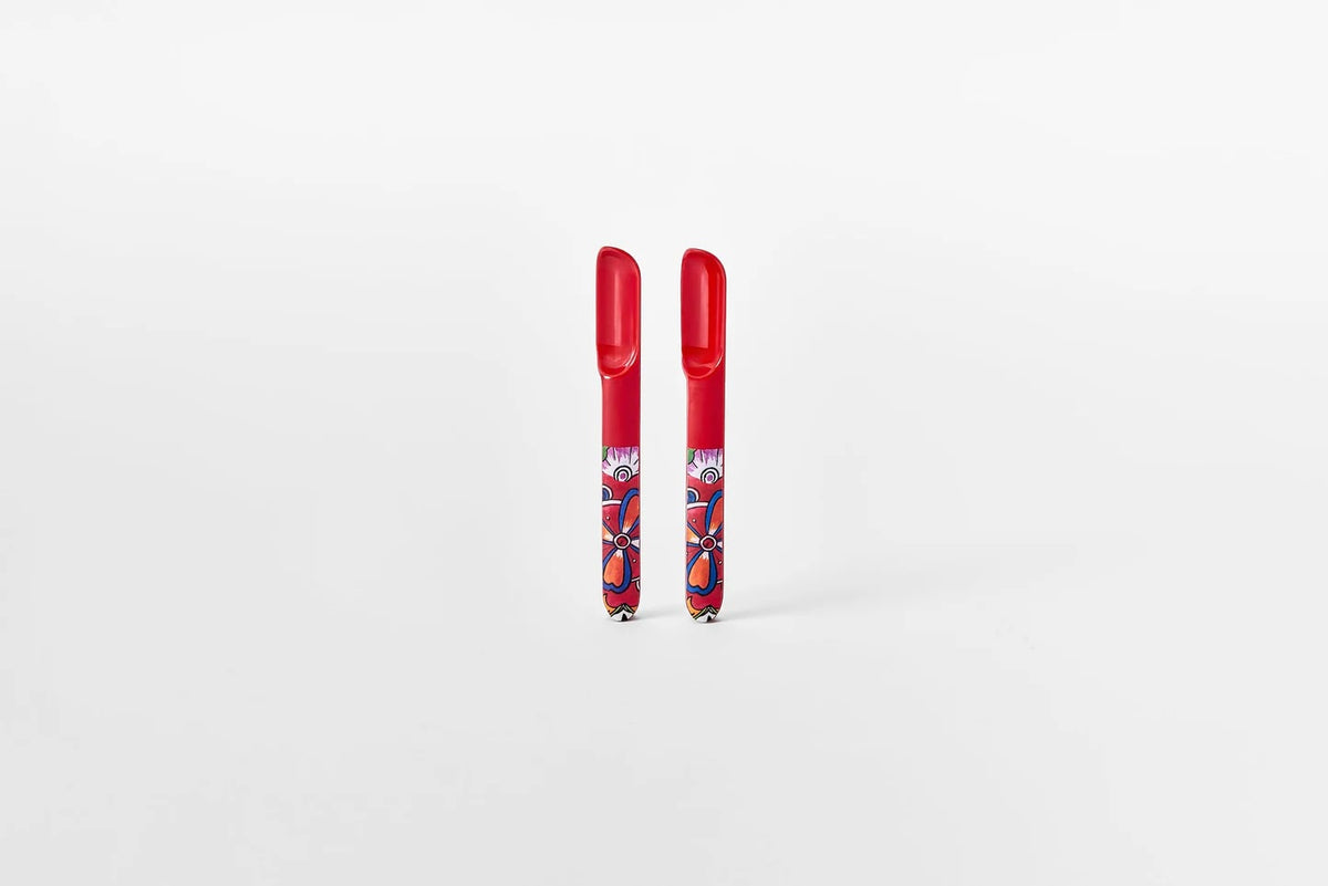 Prepara taco spoons, a pair of red scoop-shaped holders with a floral pattern, shown standing upright
