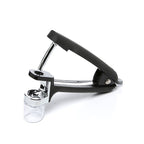 OXO Good Grips cherry and olive pitter in black with a chrome lever and a glass catch cup