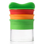 OXO Good Grips three blade hand-held spiralizer in green, red and orange with a clear collecting cup