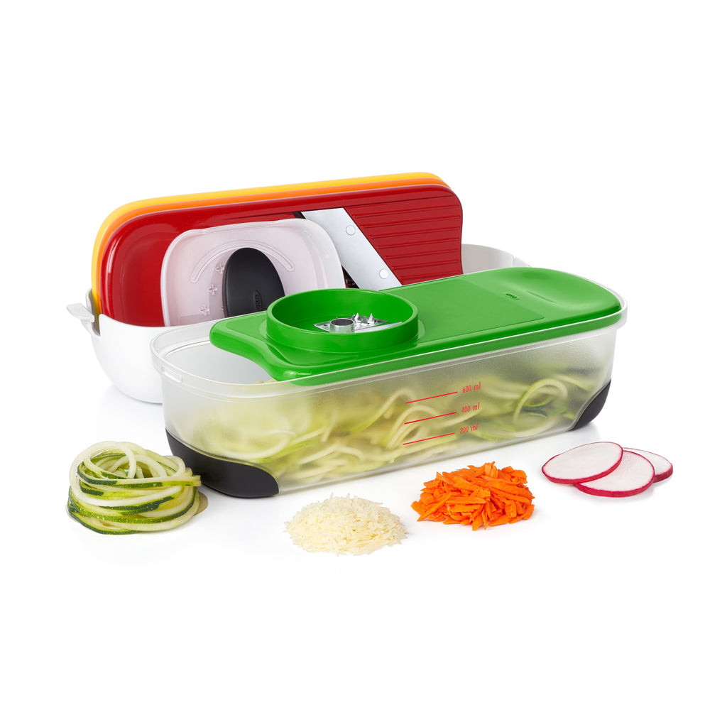 OXO spiralize, grate and slice set with red, white and green lidded containers and shredded vegetables