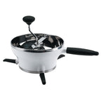 OXO Good Grips food mill in white and stainless steel with a crank handle and fold-down legs