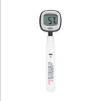 OXO Good Grips Chef's Precision digital instant read thermometer with a white handle and a display showing 57 degrees