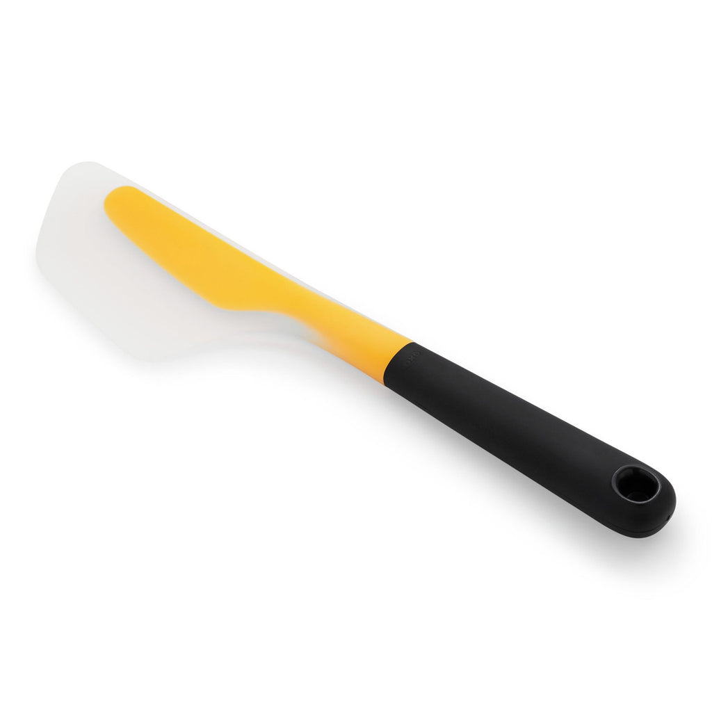 OXO Good Grips flip and fold omelette turner with a yellow and clear silicone head and a black handle