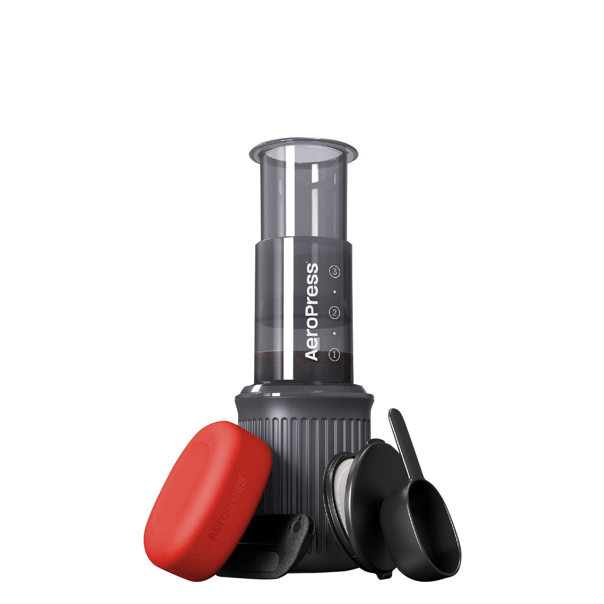 Aeropress Go travel coffee press with a red cap and cup