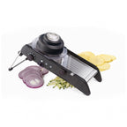 Progressive PL8 professional mandoline in black with sliced onion, zucchini and lemon