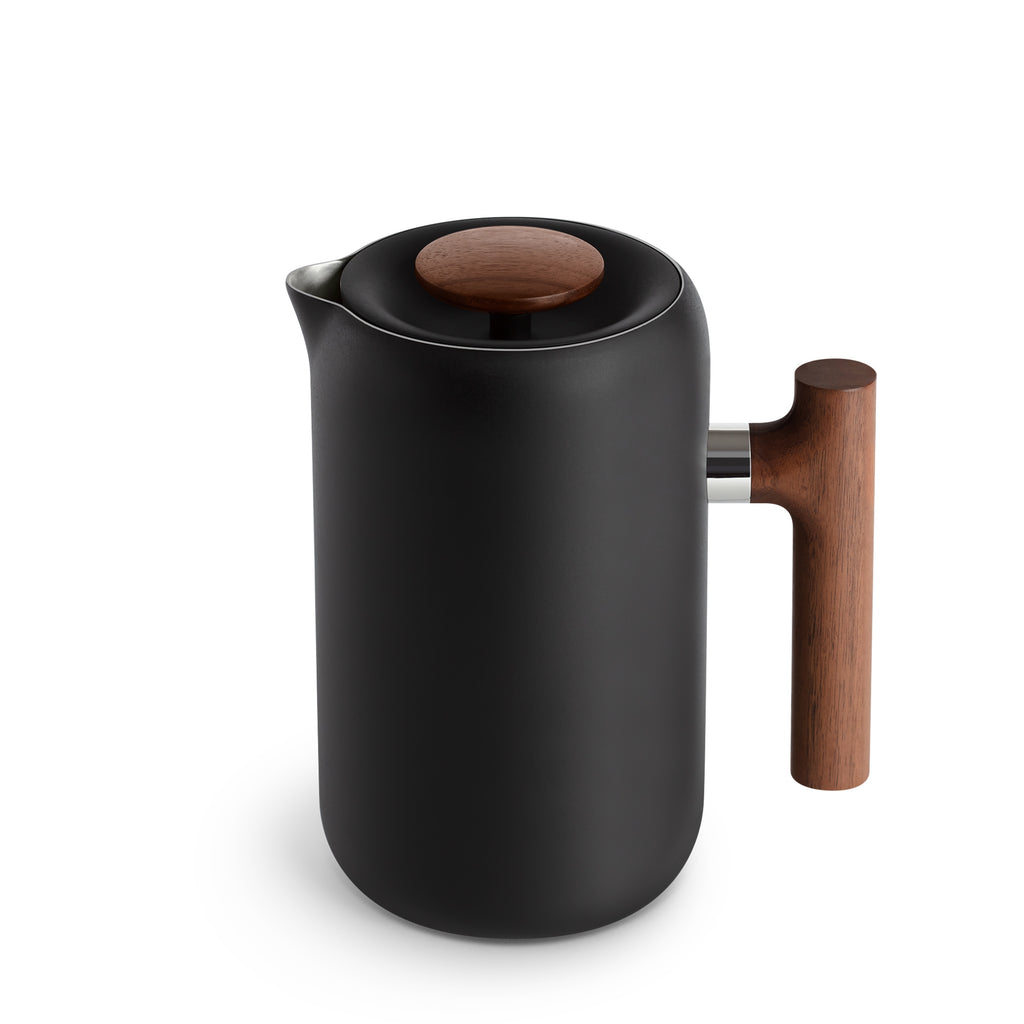 Fellow Clara French press in matt black with a walnut wood handle and lid knob