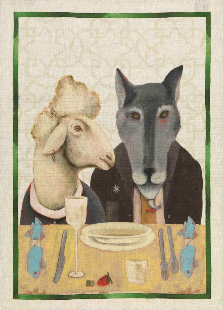 Tessitura Toscana Telerie linen tea towel with a painted sheep and wolf dining at a table