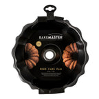 Bakemaster fluted ring cake pan in dark non-stick steel, shown in its packaging with photos of cakes