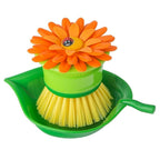 Vigar Flower Power palm dish brush with an orange flower top, yellow bristles and a green leaf holder