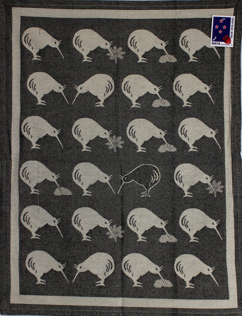Kiwi Country tea towel in black with a repeating white kiwi bird pattern