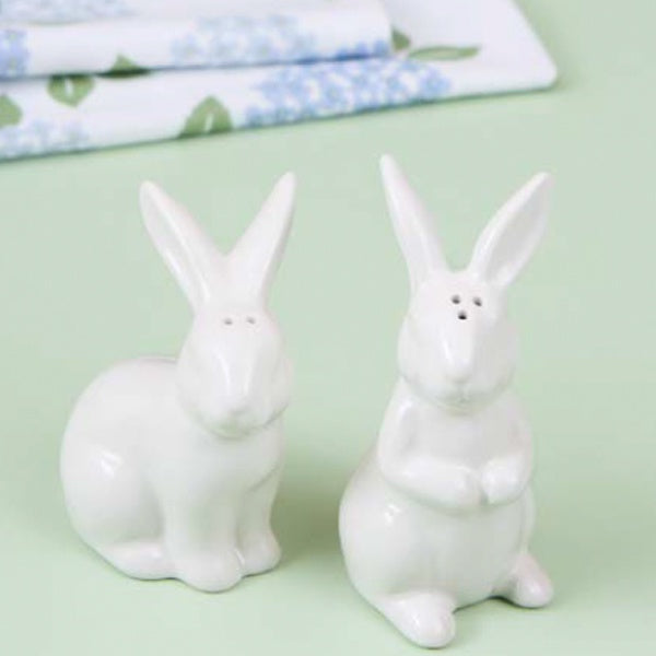 Ceramic bunnies salt and pepper shaker set in white, on a pale green backdrop