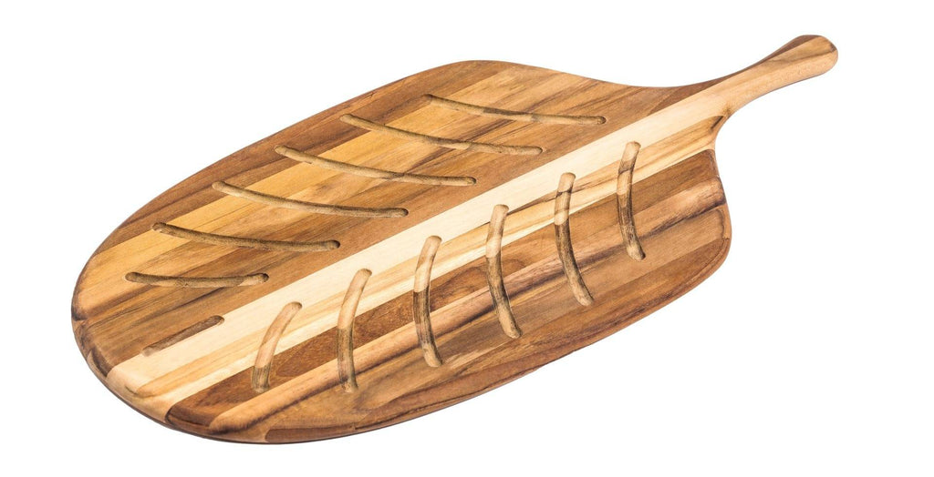 Teakhaus canoe bread board, a paddle-shaped teak board with a ridged leaf-like surface and a handle