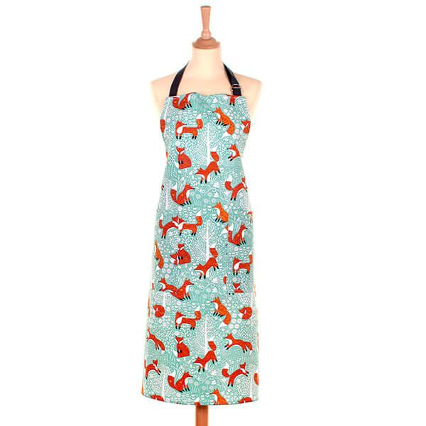 Ulster Weavers Foraging Fox cotton apron with an illustrated fox print, shown on a mannequin