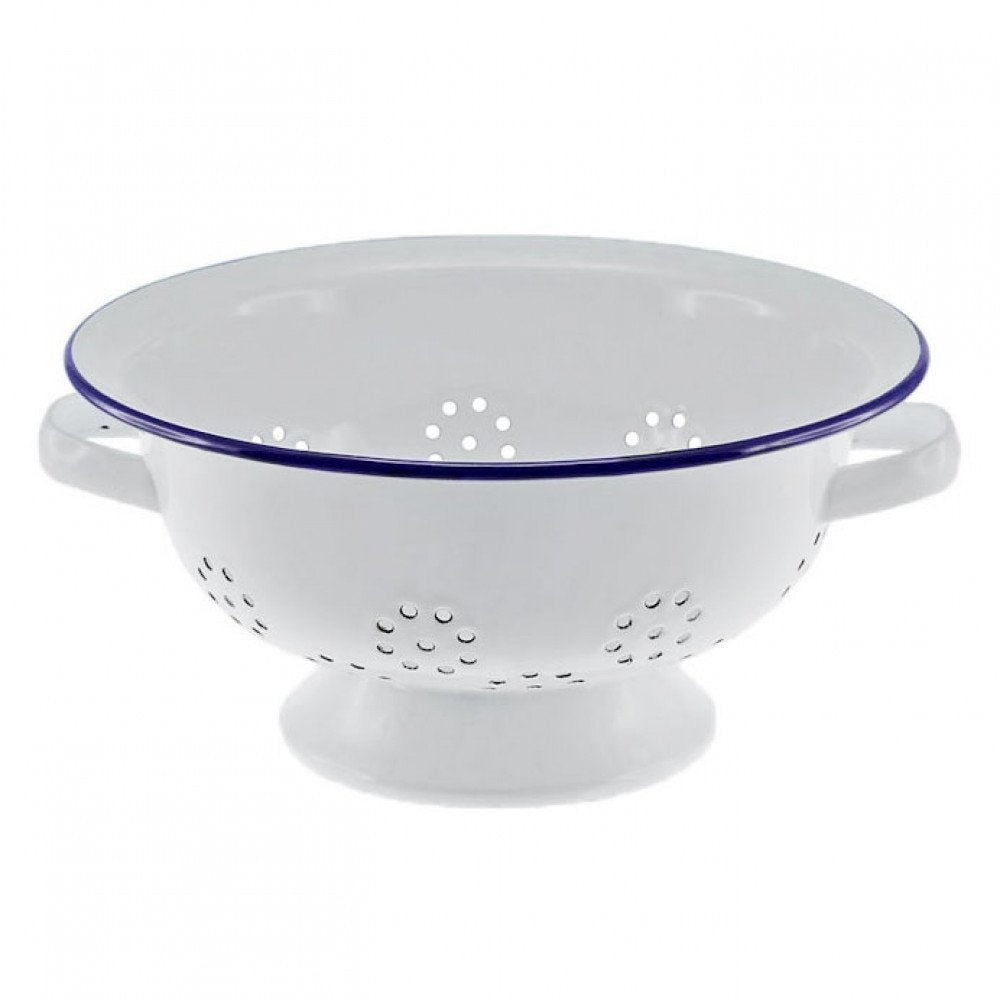 Falcon Enamelware colander in white with a navy rim and a footed base