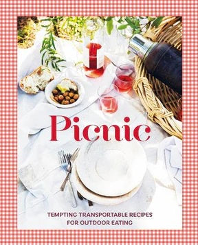 Picnic cookbook cover with a gingham border and a photo of an outdoor picnic spread