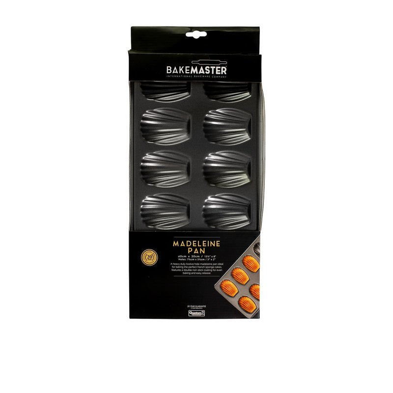 Bakemaster madeleine pan in dark non-stick steel, shown in its packaging