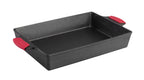 Lodge cast iron roasting dish, 23x33cm, in black with red silicone handle grips