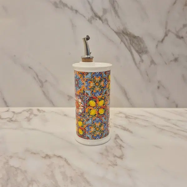 Camastra ceramic olive oil cruet, 250ml, with a colourful lemon tile design, on a marble surface